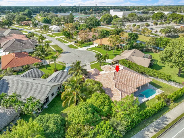an aerial view of residential houses with outdoor space
