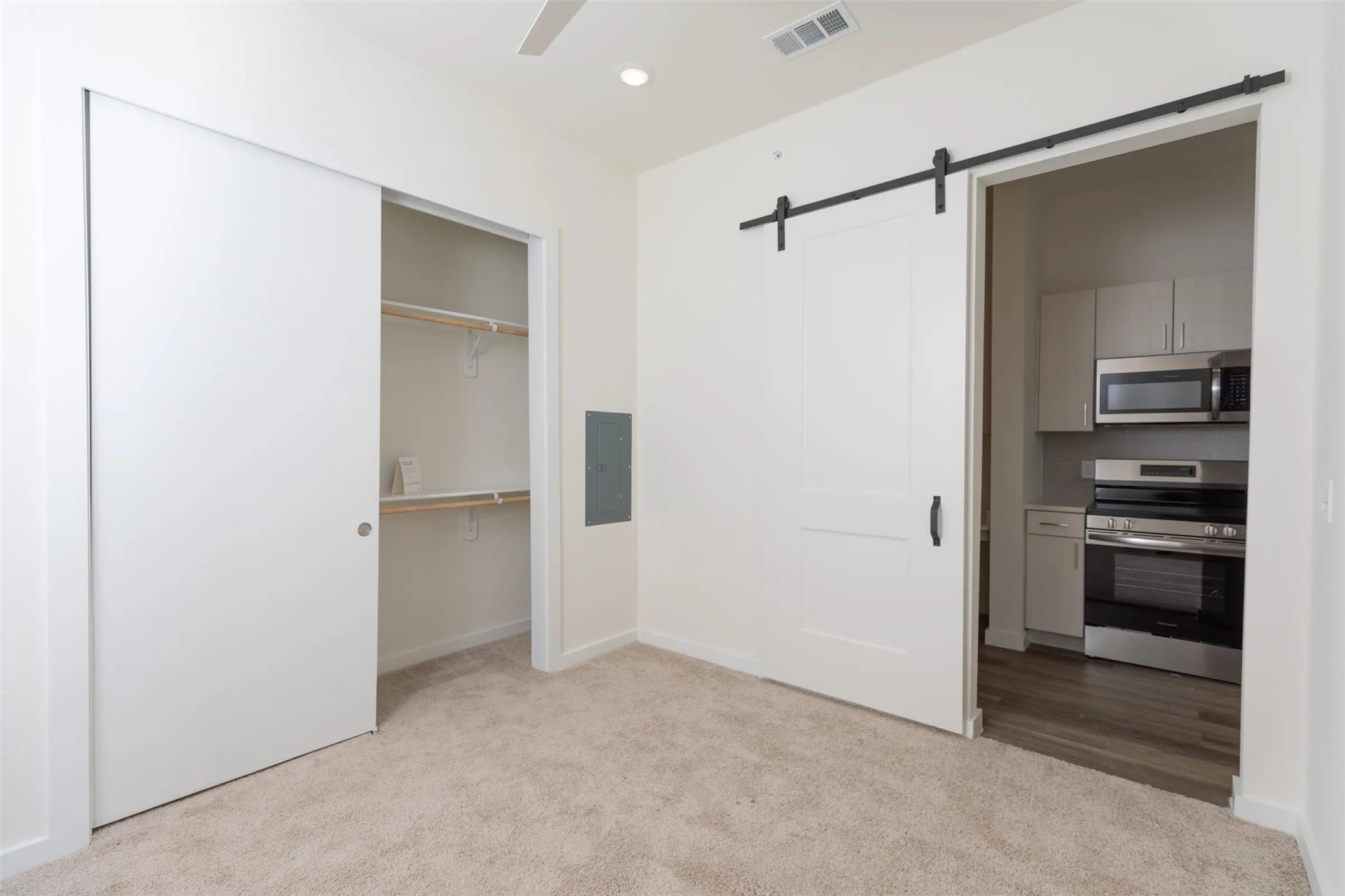 1690 North Loop, Unit 489 Houston, TX 77009 - Photo 14 of 28 a view of a kitchen with a closet and electronic appliances