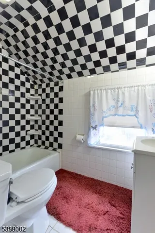 a bathroom with a toilet and a sink