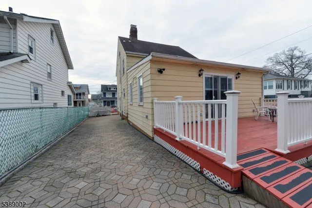 a front view of a house with wooden fence