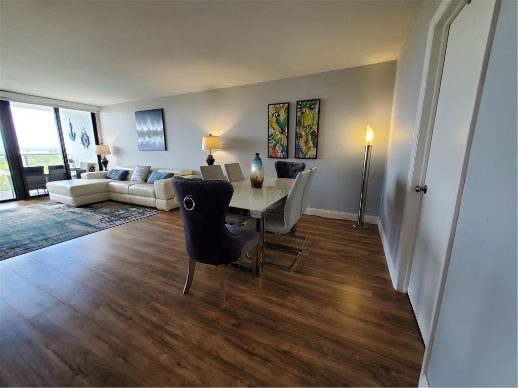 1401 North Riverside Drive, Unit 1503 Pompano Beach, FL 33062 - Photo 12 of 34 a living room with furniture and a wooden floor