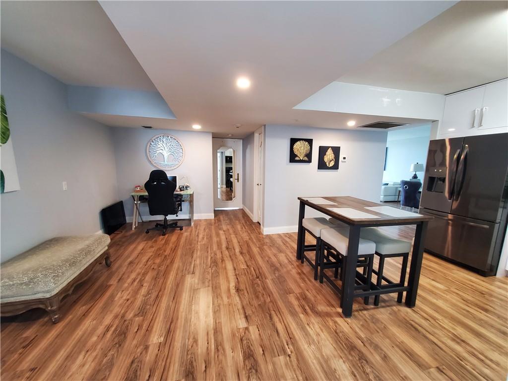 1401 North Riverside Drive, Unit 1503 Pompano Beach, FL 33062 - Photo 19 of 34 a living room with furniture and a wooden floor