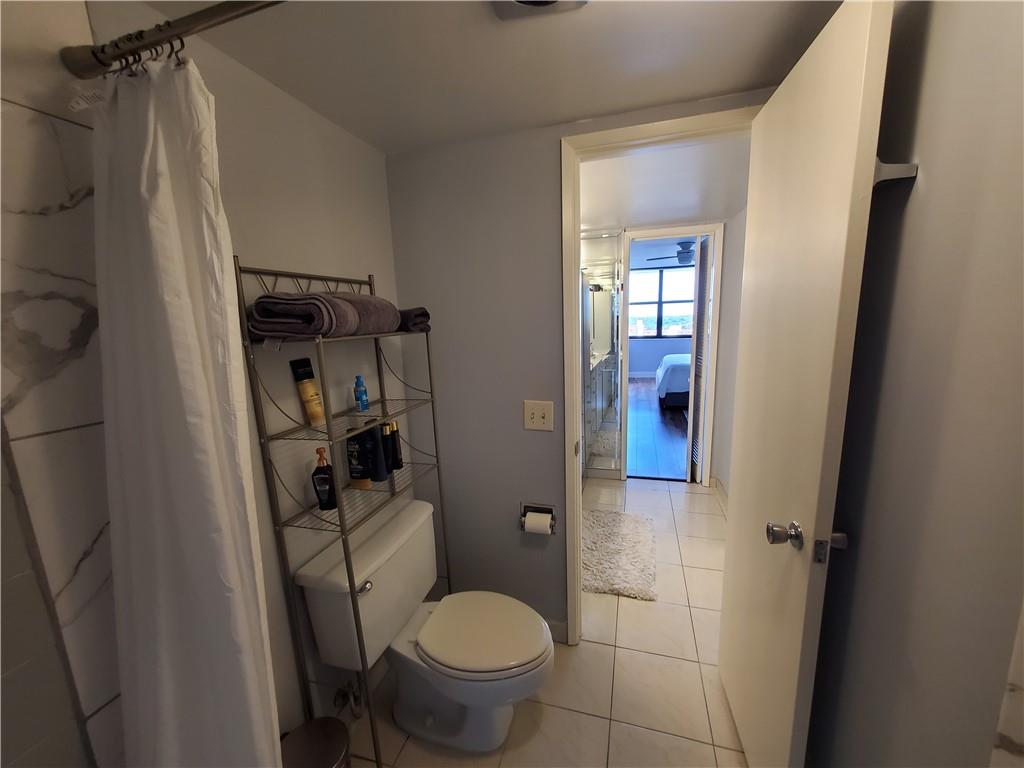 1401 North Riverside Drive, Unit 1503 Pompano Beach, FL 33062 - Photo 24 of 34 a bathroom with a toilet and a shower