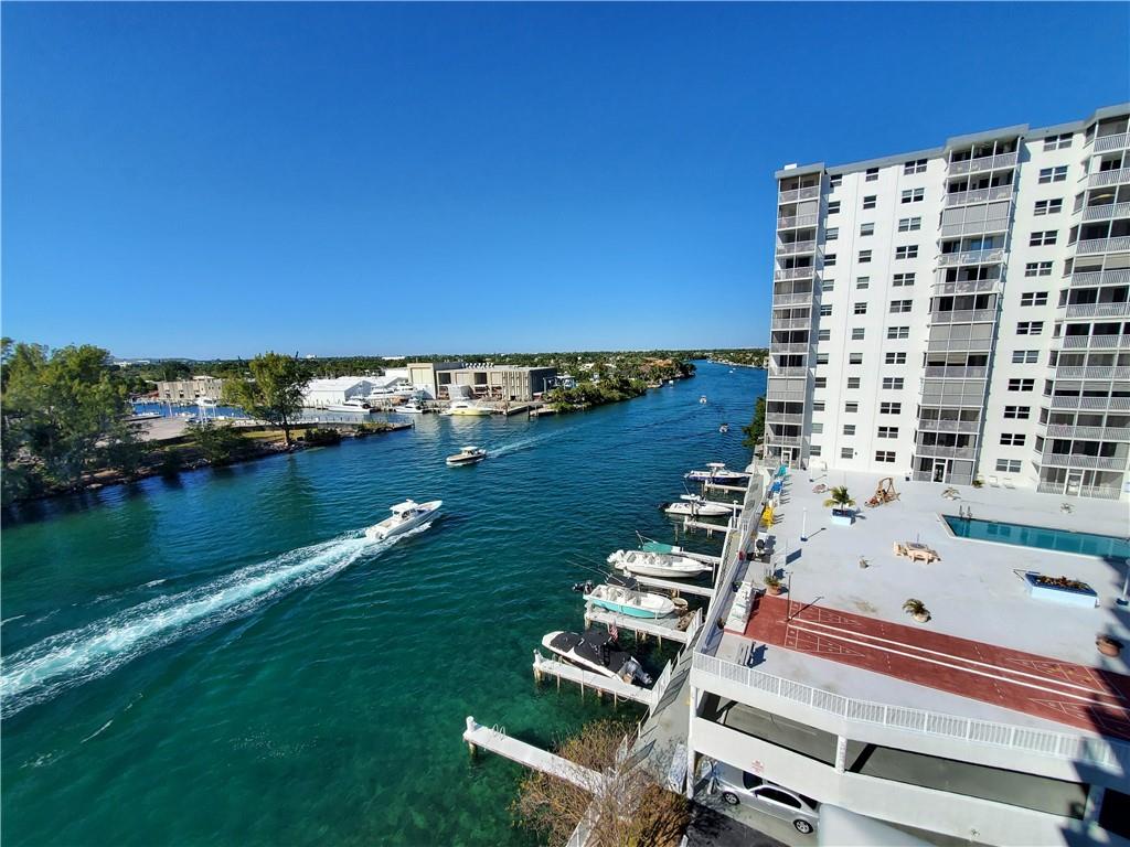 1401 North Riverside Drive, Unit 1503 Pompano Beach, FL 33062 - Photo 4 of 34 swimming pool with wooden fence