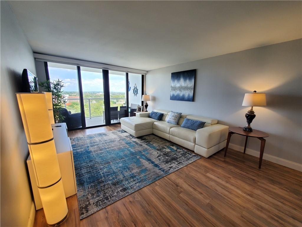 1401 North Riverside Drive, Unit 1503 Pompano Beach, FL 33062 - Photo 8 of 34 a living room with furniture and a floor to ceiling window