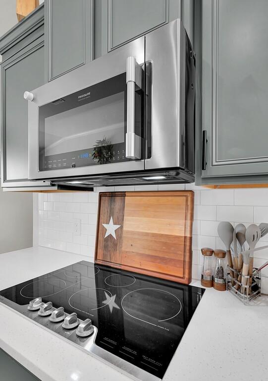 404 Calder Street Waco, TX 76712 - Photo 14 of 40 a kitchen with a stove and a microwave