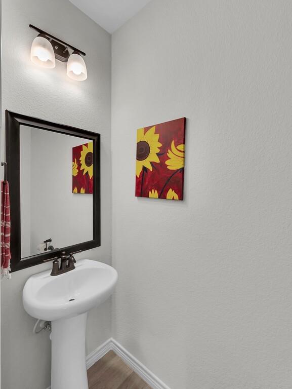 404 Calder Street Waco, TX 76712 - Photo 18 of 40 a bathroom with a sink and a mirror