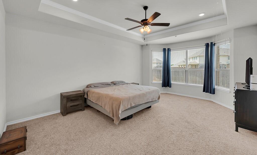 404 Calder Street Waco, TX 76712 - Photo 19 of 40 a bedroom with a bed and glass door