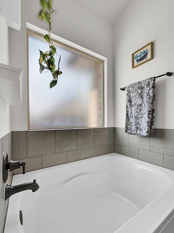 404 Calder Street Waco, TX 76712 - Photo 22 of 40 a bathroom with a bathtub sink and vanity