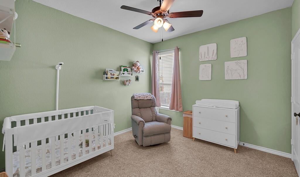404 Calder Street Waco, TX 76712 - Photo 26 of 40 a bedroom with furniture and a wooden floor