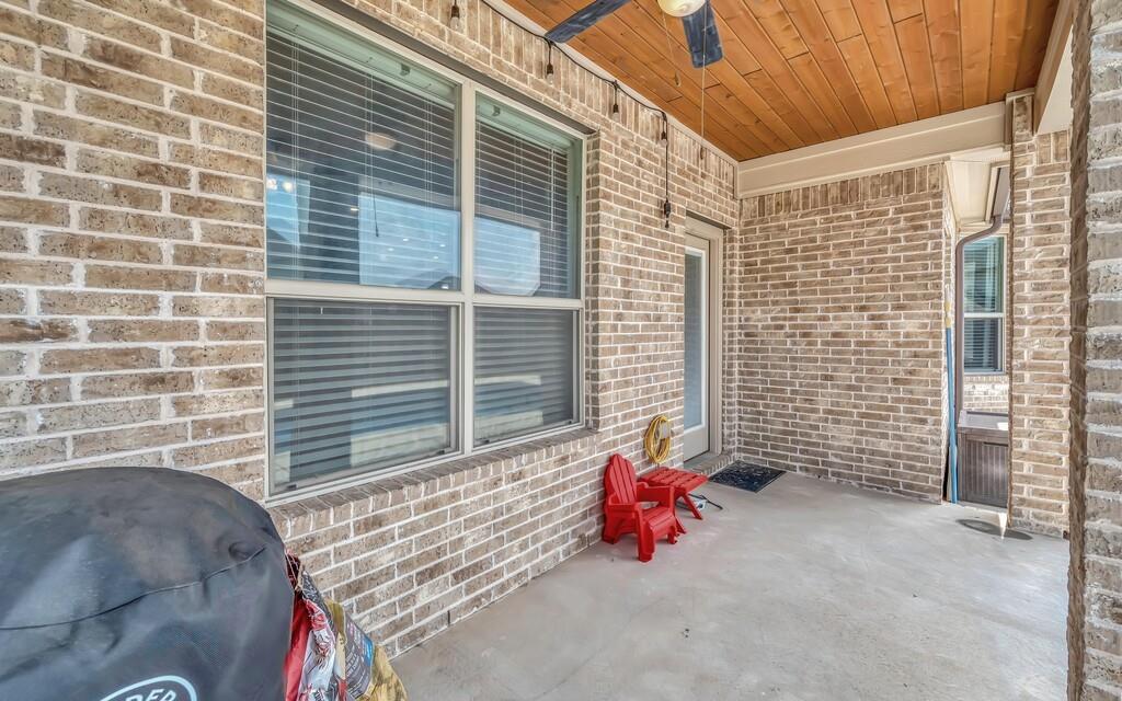 404 Calder Street Waco, TX 76712 - Photo 27 of 40 a view of a door with a chair and a fire pit