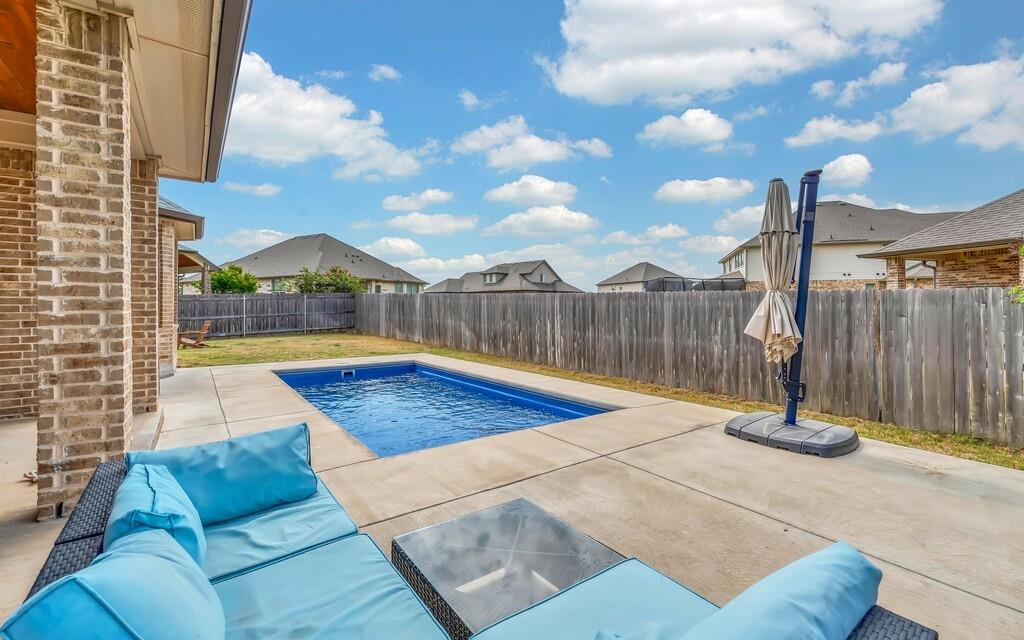 404 Calder Street Waco, TX 76712 - Photo 28 of 40 a view of a swimming pool with a lounge chairs