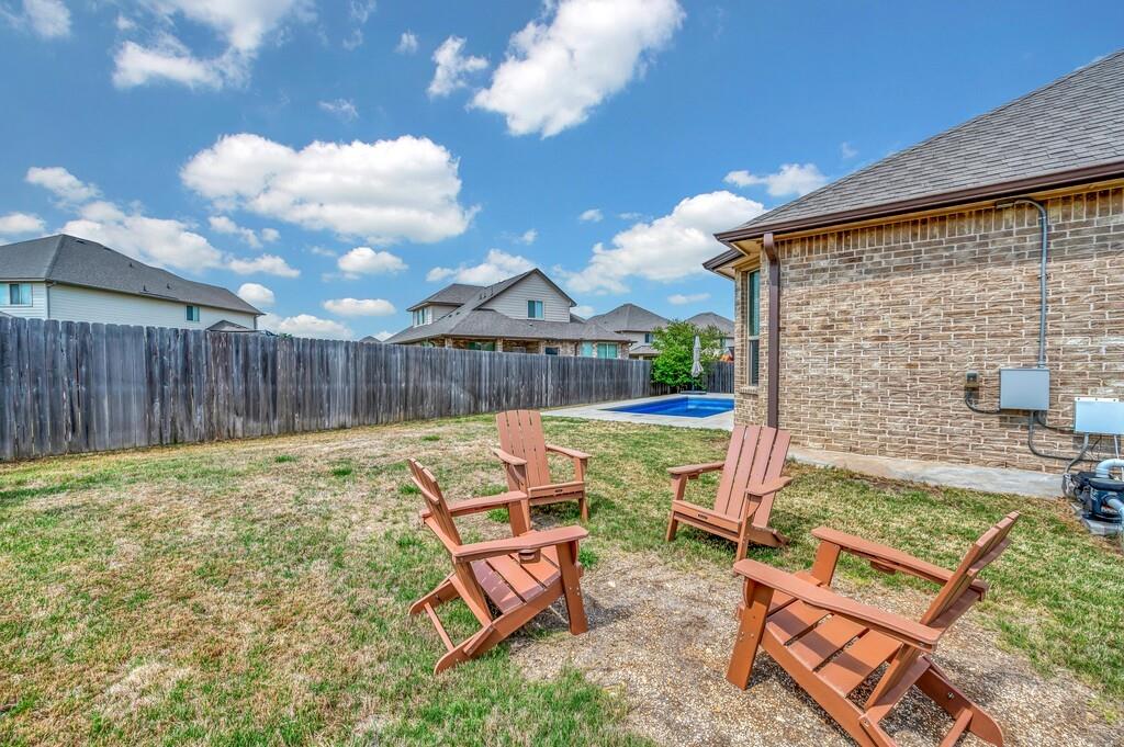 404 Calder Street Waco, TX 76712 - Photo 30 of 40 a backyard of a house with table and chairs
