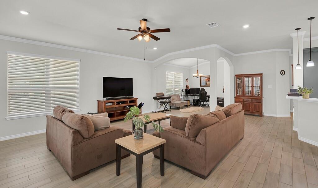 404 Calder Street Waco, TX 76712 - Photo 6 of 40 a living room with furniture and a flat screen tv