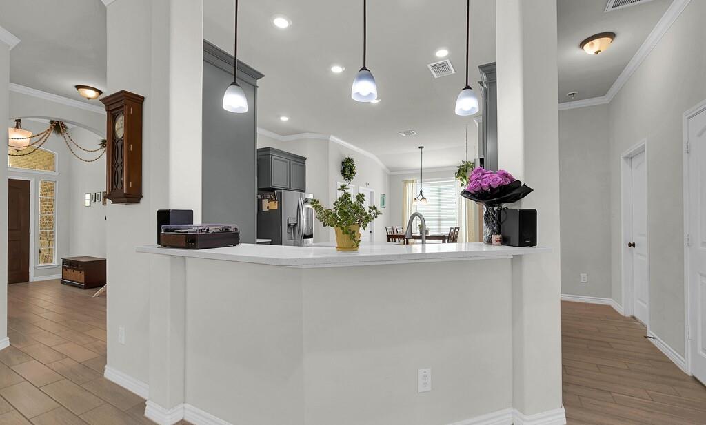 404 Calder Street Waco, TX 76712 - Photo 10 of 40 a kitchen with stainless steel appliances a sink and a refrigerator