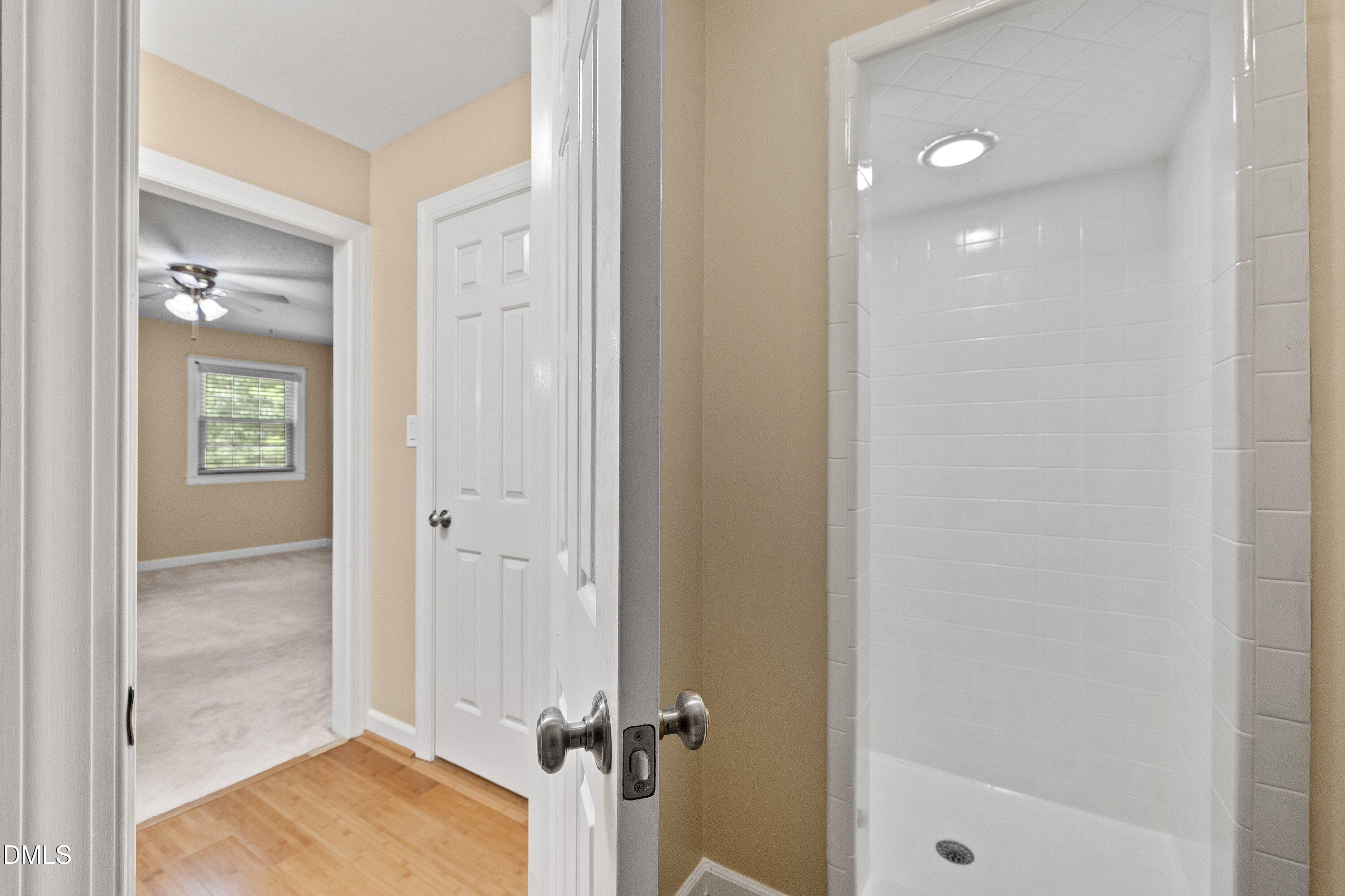 8133 Holly Forest Road Wake Forest, NC 27587 - Photo 37 of 50 a view of a bathroom with a shower and a sink