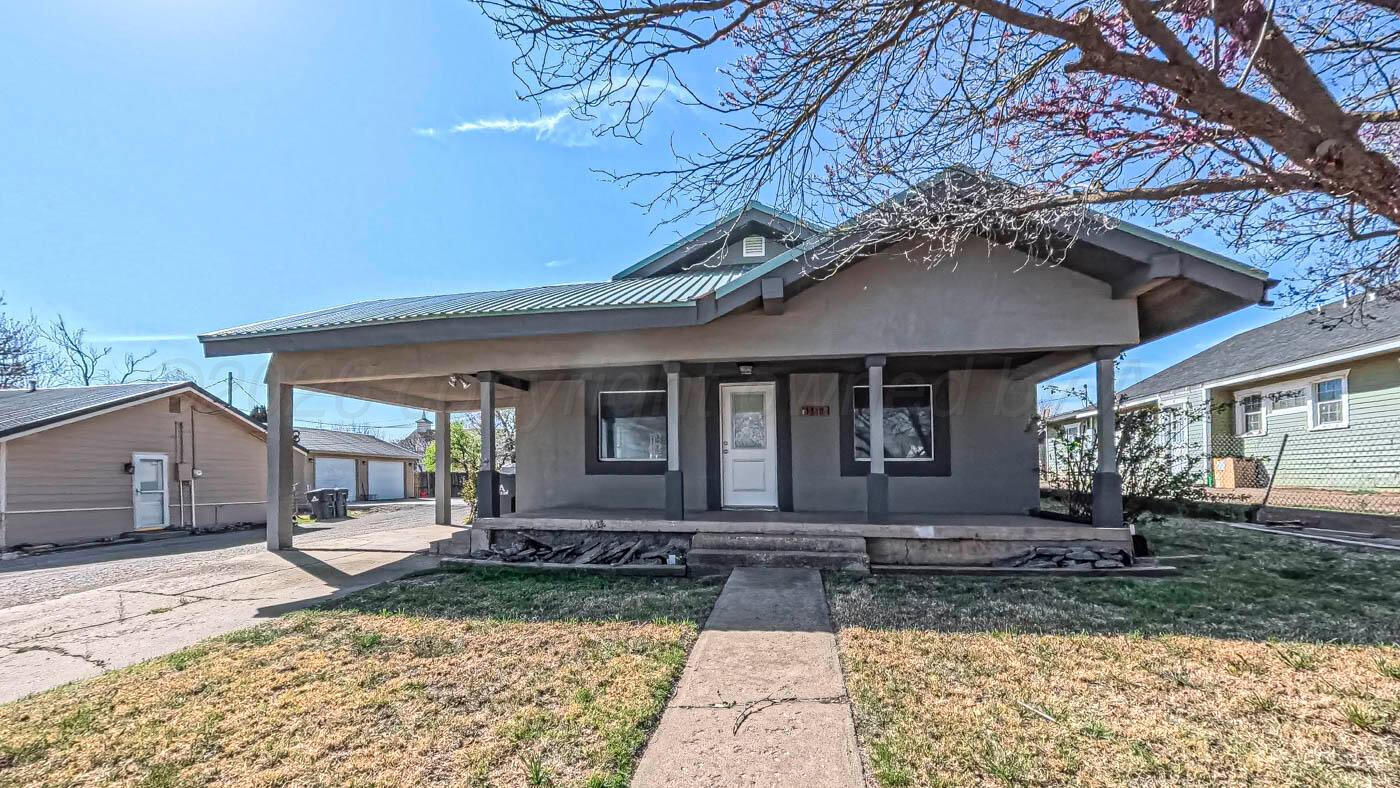 1316 Withers Avenue Amarillo, TX 79108 - Photo 1 of 19 a front view of a house with garden