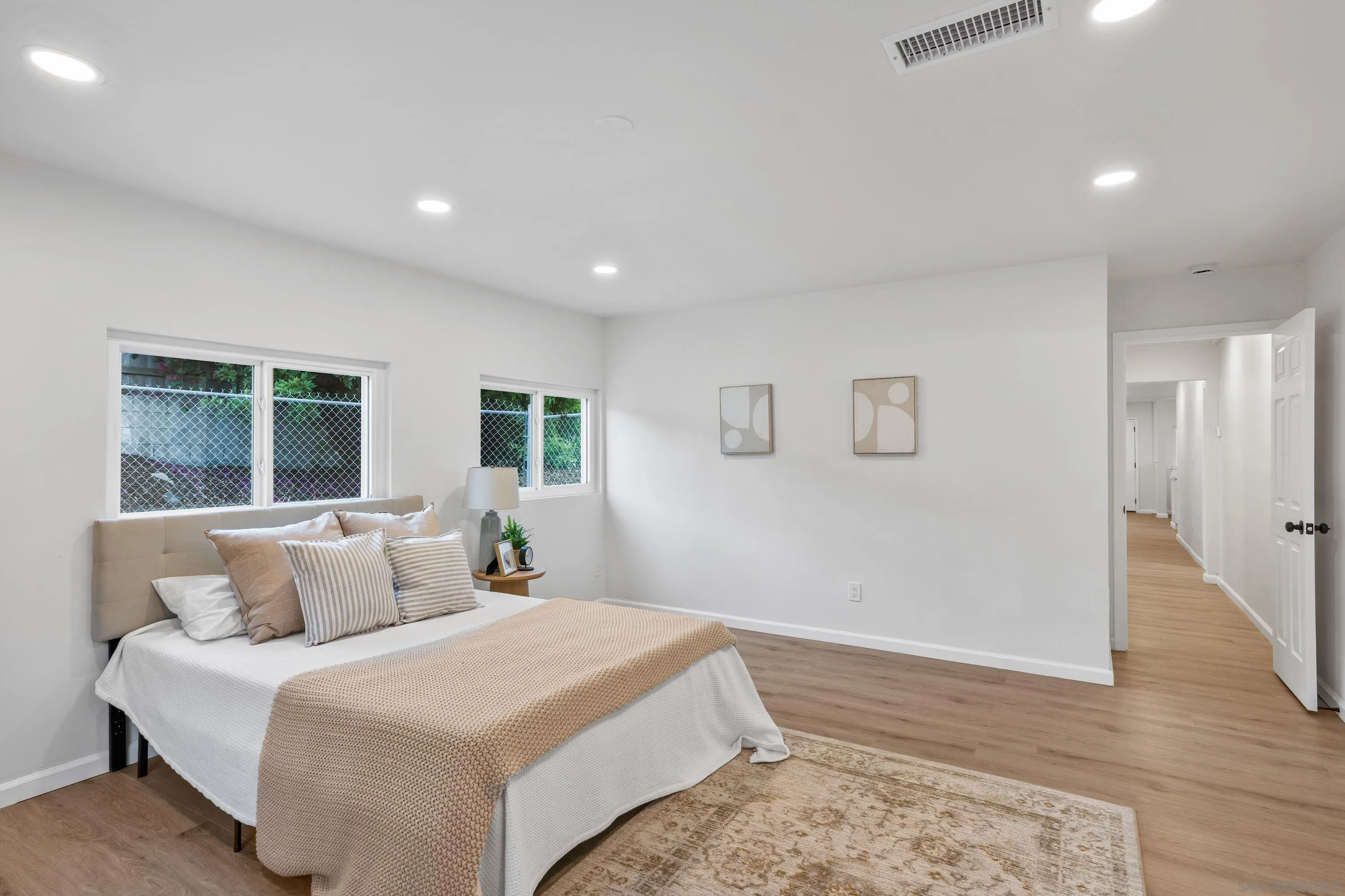 3457 Kenora Drive Spring Valley, CA 91977 - Photo 13 of 26 a bedroom with a large bed and a window