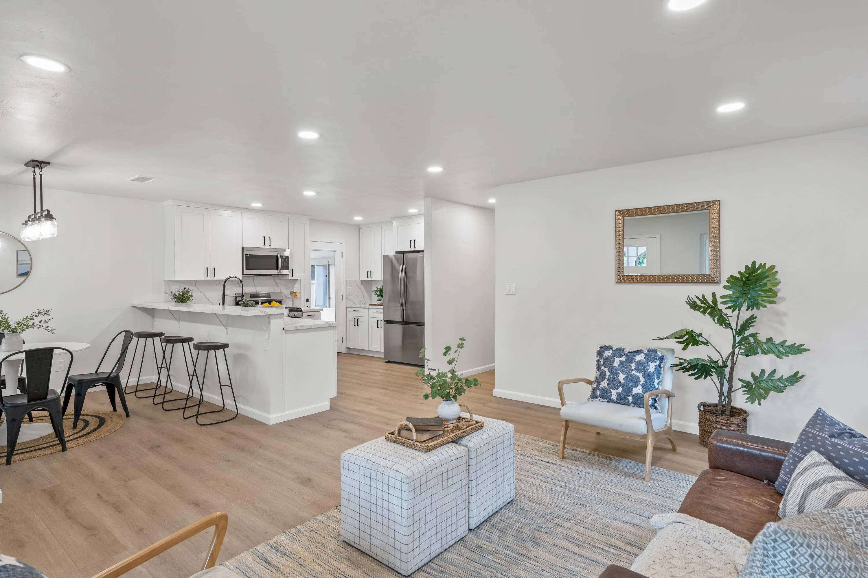 3457 Kenora Drive Spring Valley, CA 91977 - Photo 8 of 26 a living room with furniture kitchen and a table