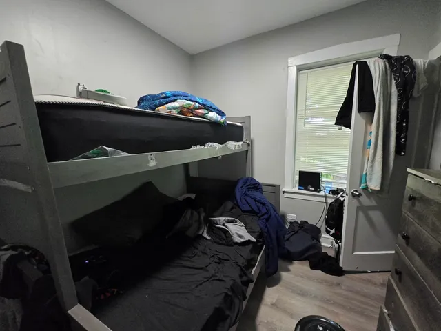 a living room with furniture and rug wall