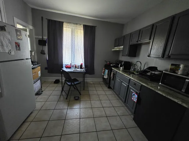 a bedroom with a bed and dresser