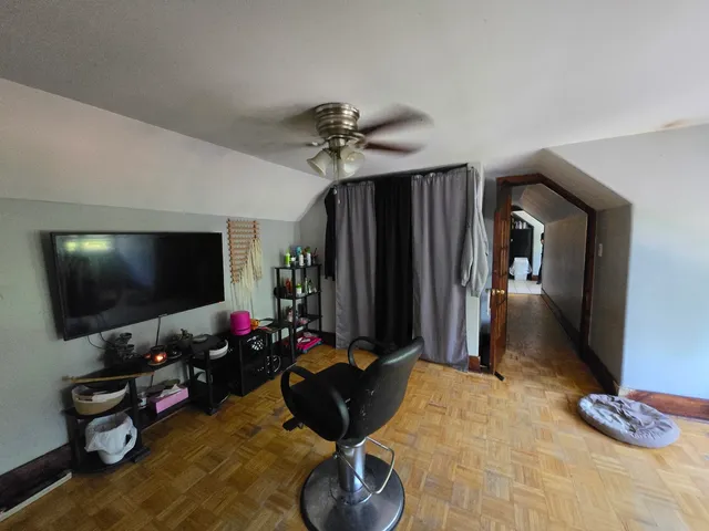 a bedroom with furniture and a closet