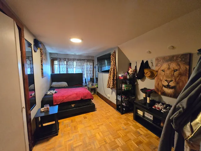 a bed room with a bed next to a window