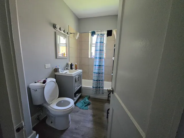 a white toilet sitting next to a bathroom sink