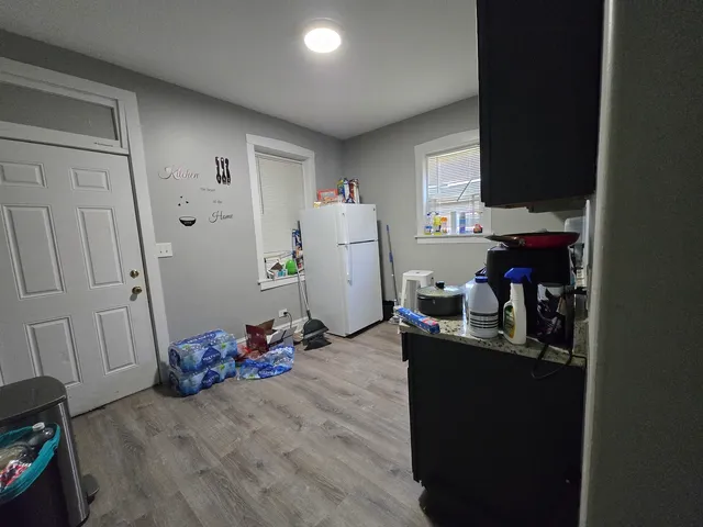 a kitchen with a sink appliances and cabinets