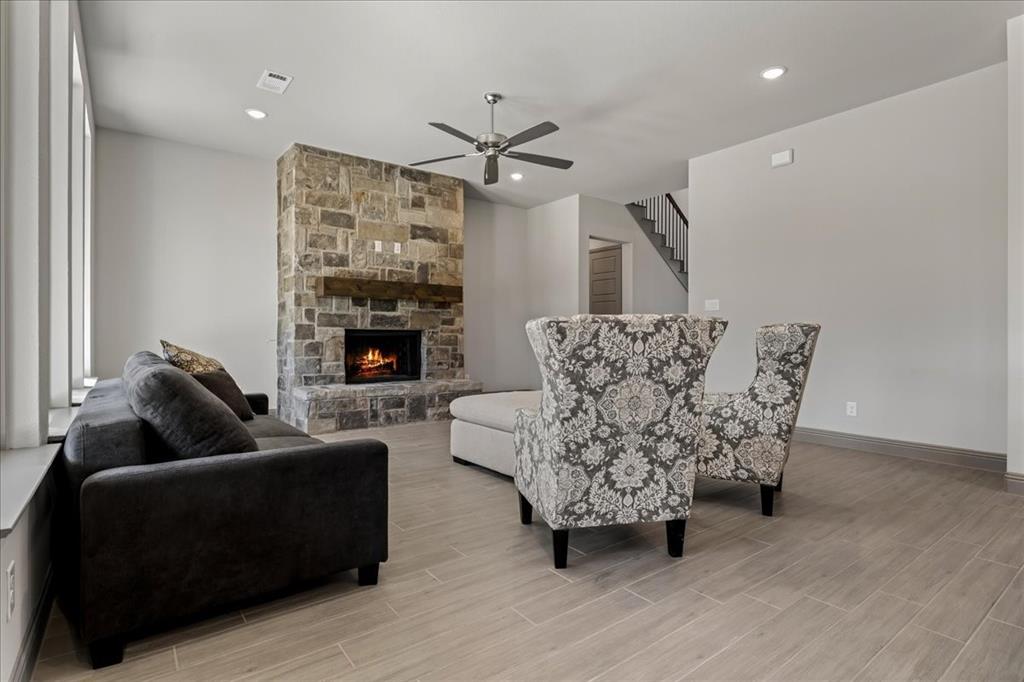 131 Spring Valley Road Paradise, TX 76073 - Photo 7 of 40 a living room with furniture and a fireplace
