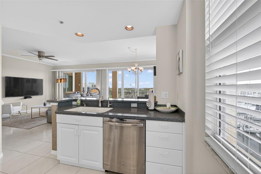 2060 Matecumbe Key Road, Unit 2506 Punta Gorda, FL 33955 - Photo 9 of 38 a kitchen with a sink stove and cabinets