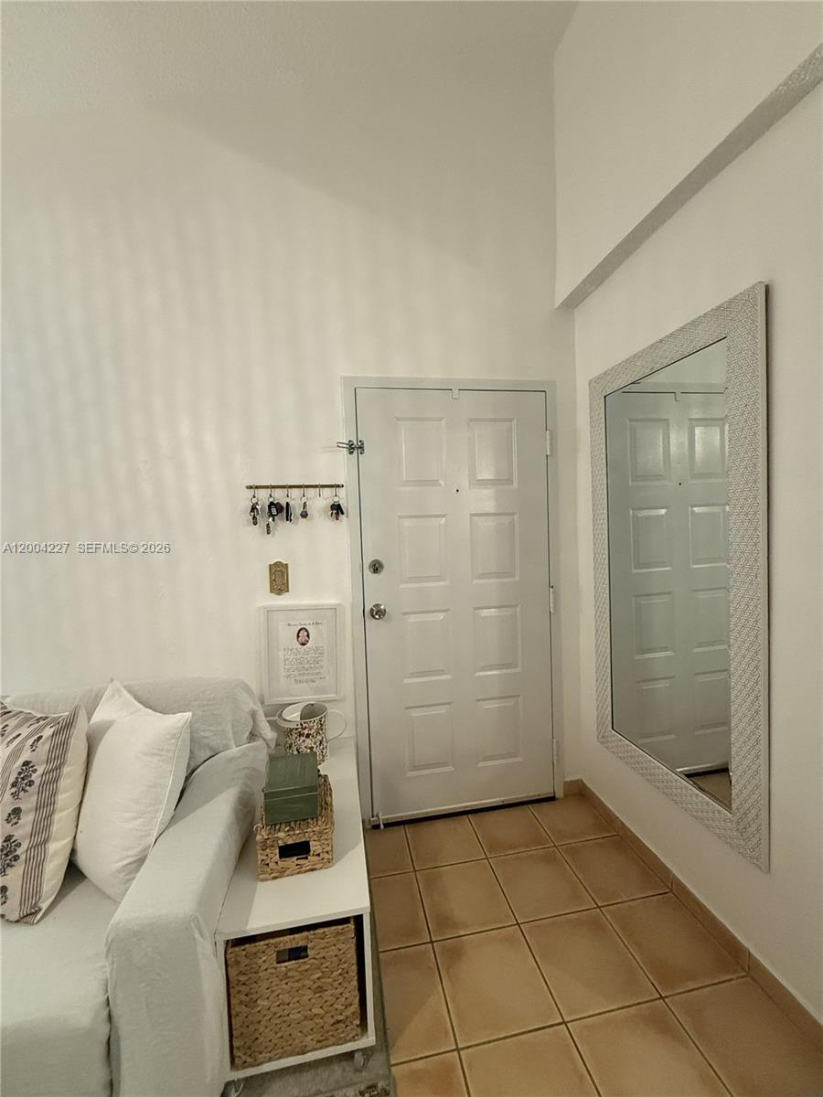 15650 Southwest 80th Street, Unit F208 Miami, FL 33193 - Photo 4 of 19 a bathroom with a shower