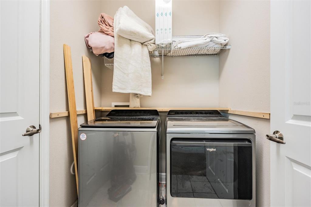 3016 Alachua Place New Port Richey, FL 34655 - Photo 25 of 65 a kitchen with a stove and a refrigerator