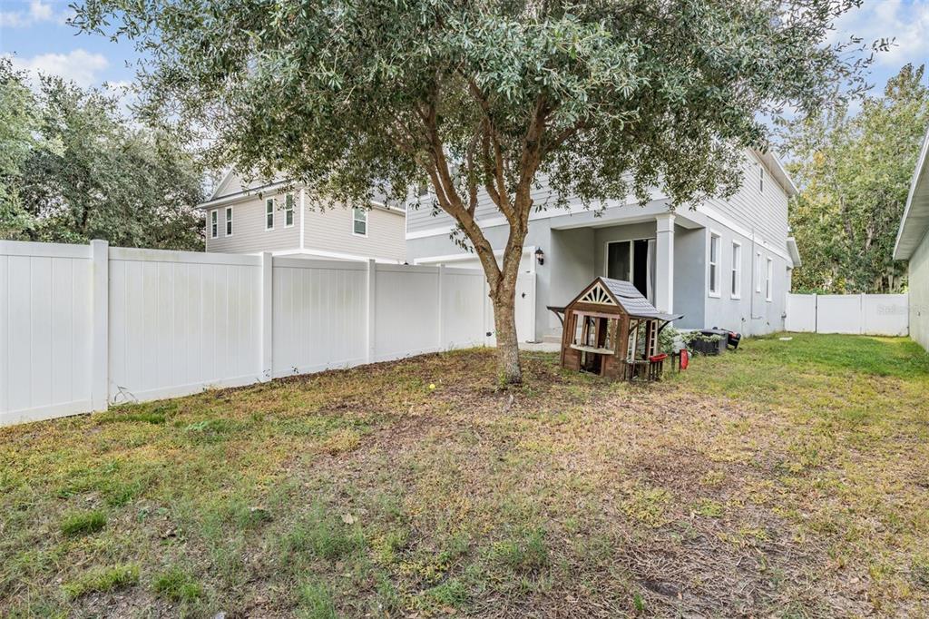 3016 Alachua Place New Port Richey, FL 34655 - Photo 30 of 65 a house with trees in the background