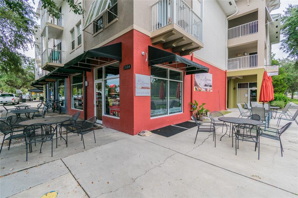 3016 Alachua Place New Port Richey, FL 34655 - Photo 33 of 65 a view of a patio with a table and chairs and table in a patio