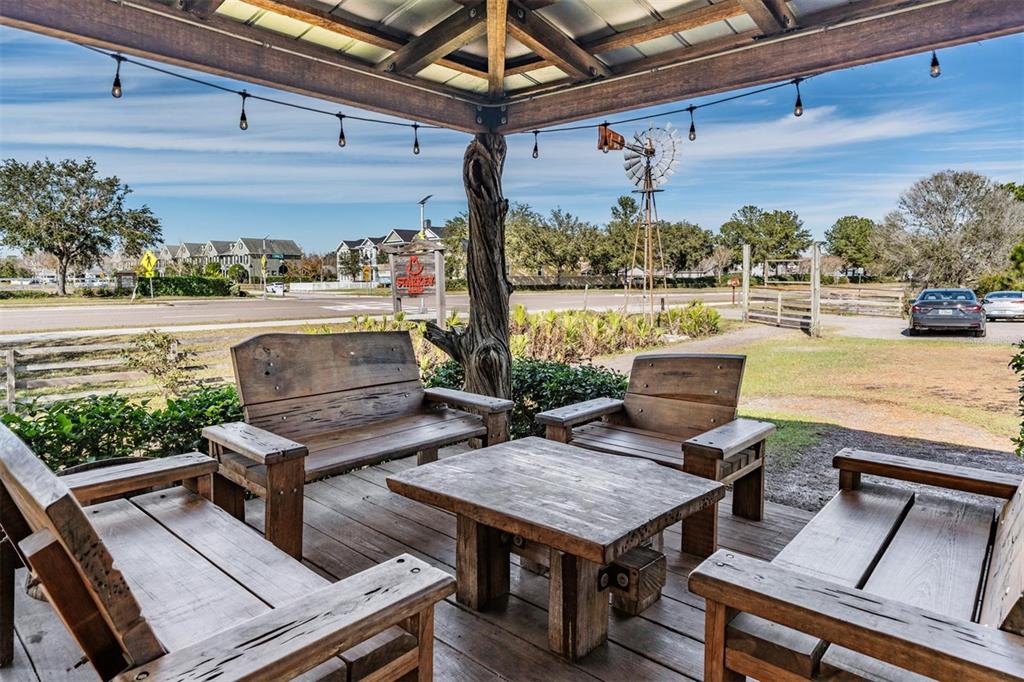 3016 Alachua Place New Port Richey, FL 34655 - Photo 50 of 65 a view of a patio with couches chairs potted plants and water view