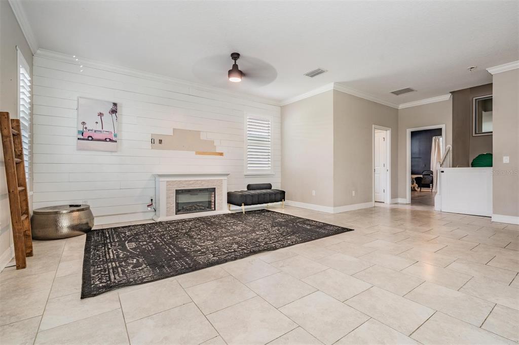3016 Alachua Place New Port Richey, FL 34655 - Photo 7 of 65 a view of a livingroom with furniture and a fireplace