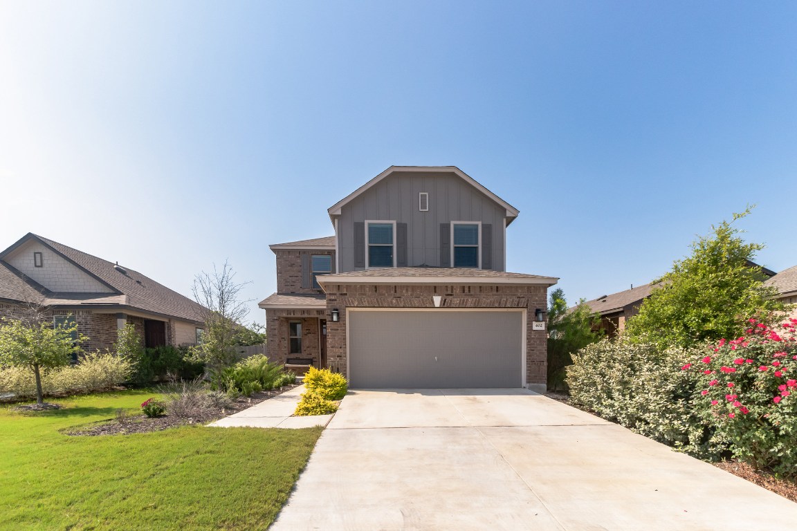 402 Thunder Valley Trail Georgetown, TX 78626 - Photo 1 of 1 a front view of a house with a yard and garage