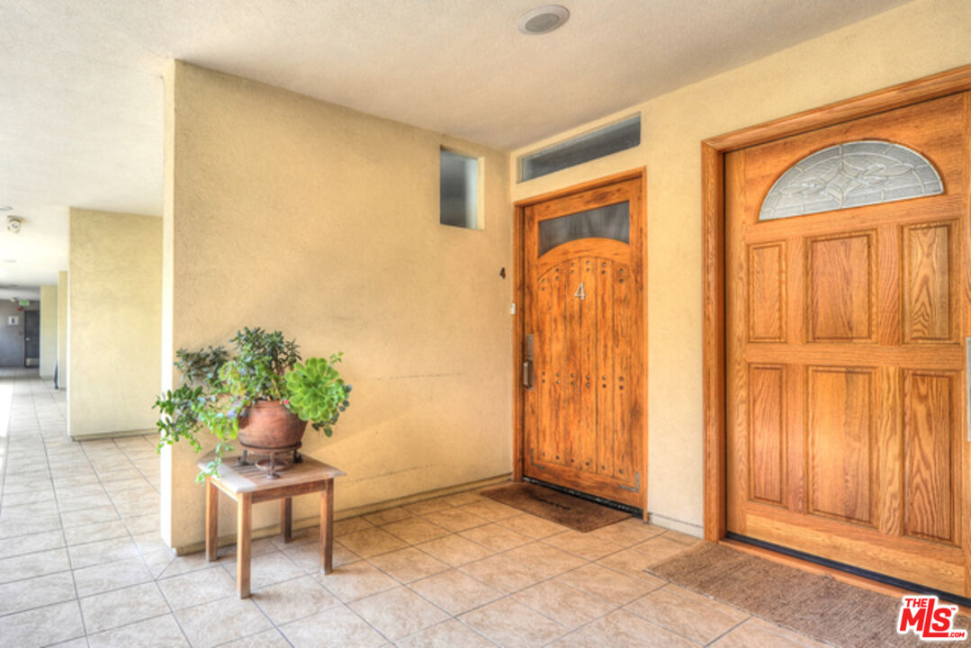 4 Lighthouse Street, Unit 5 Marina del Rey, CA 90292 - Photo 2 of 25 a living room with furniture and a window