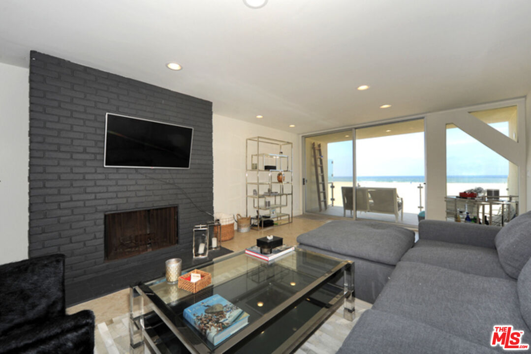 4 Lighthouse Street, Unit 5 Marina del Rey, CA 90292 - Photo 4 of 25 a living room with furniture fireplace and a flat screen tv