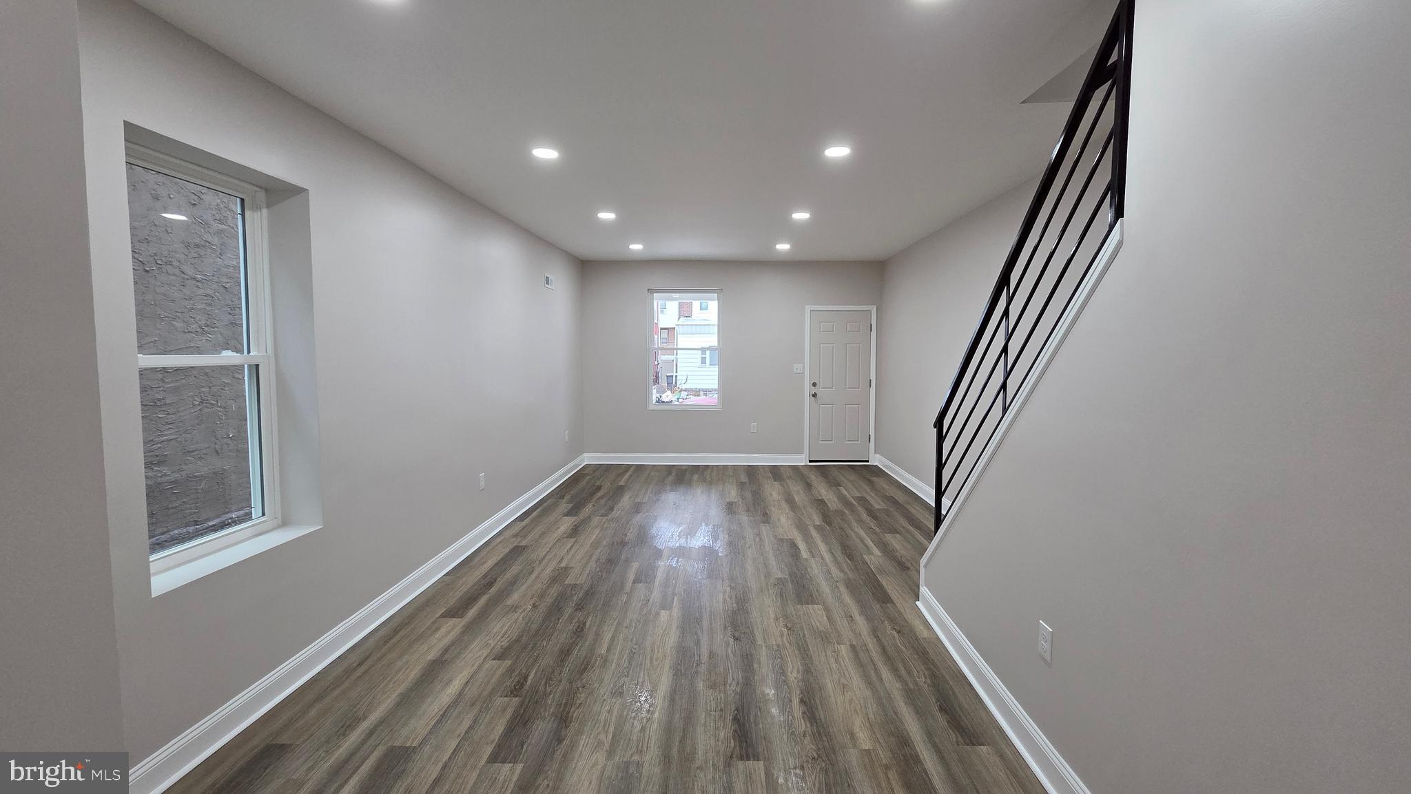 5706 Vandike Street Philadelphia, PA 19135 - Photo 13 of 32 wooden floor in an empty room with a window