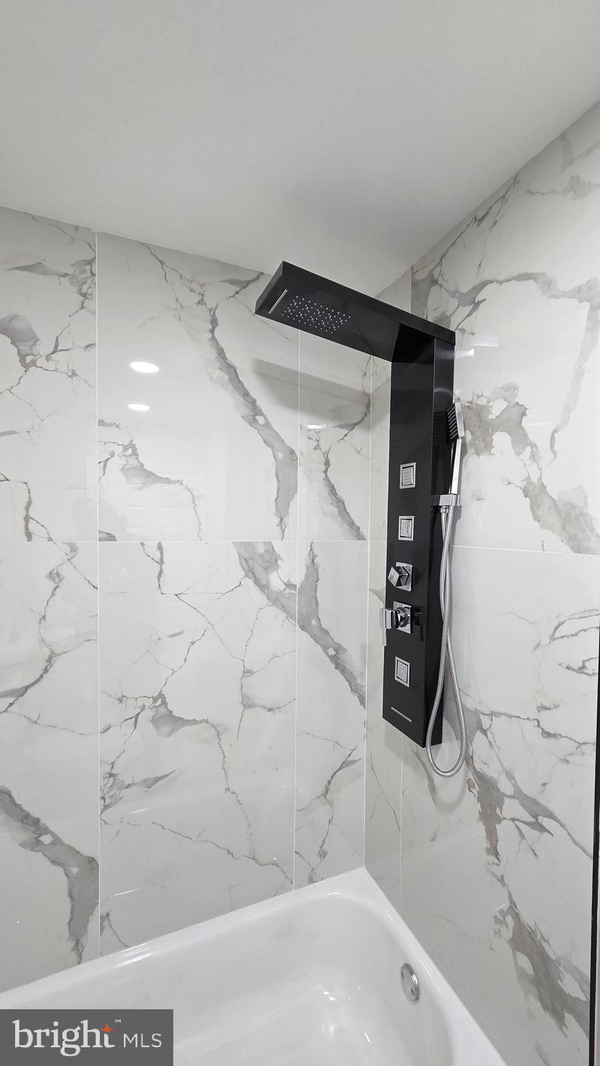 5706 Vandike Street Philadelphia, PA 19135 - Photo 20 of 32 a bathroom with a bathtub and shower