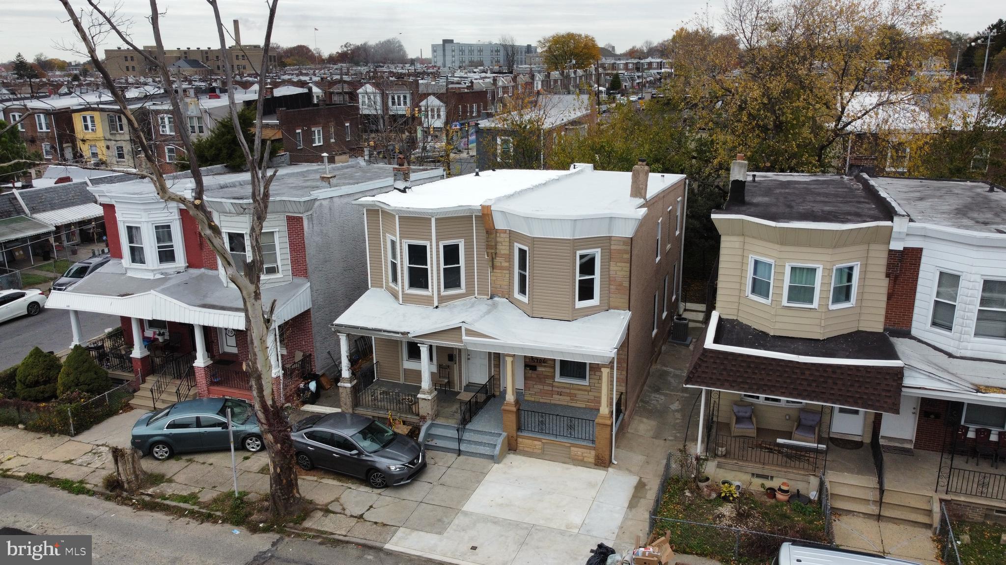 5706 Vandike Street Philadelphia, PA 19135 - Photo 3 of 32 a view of a patio with table and chairs with wooden floor and fence