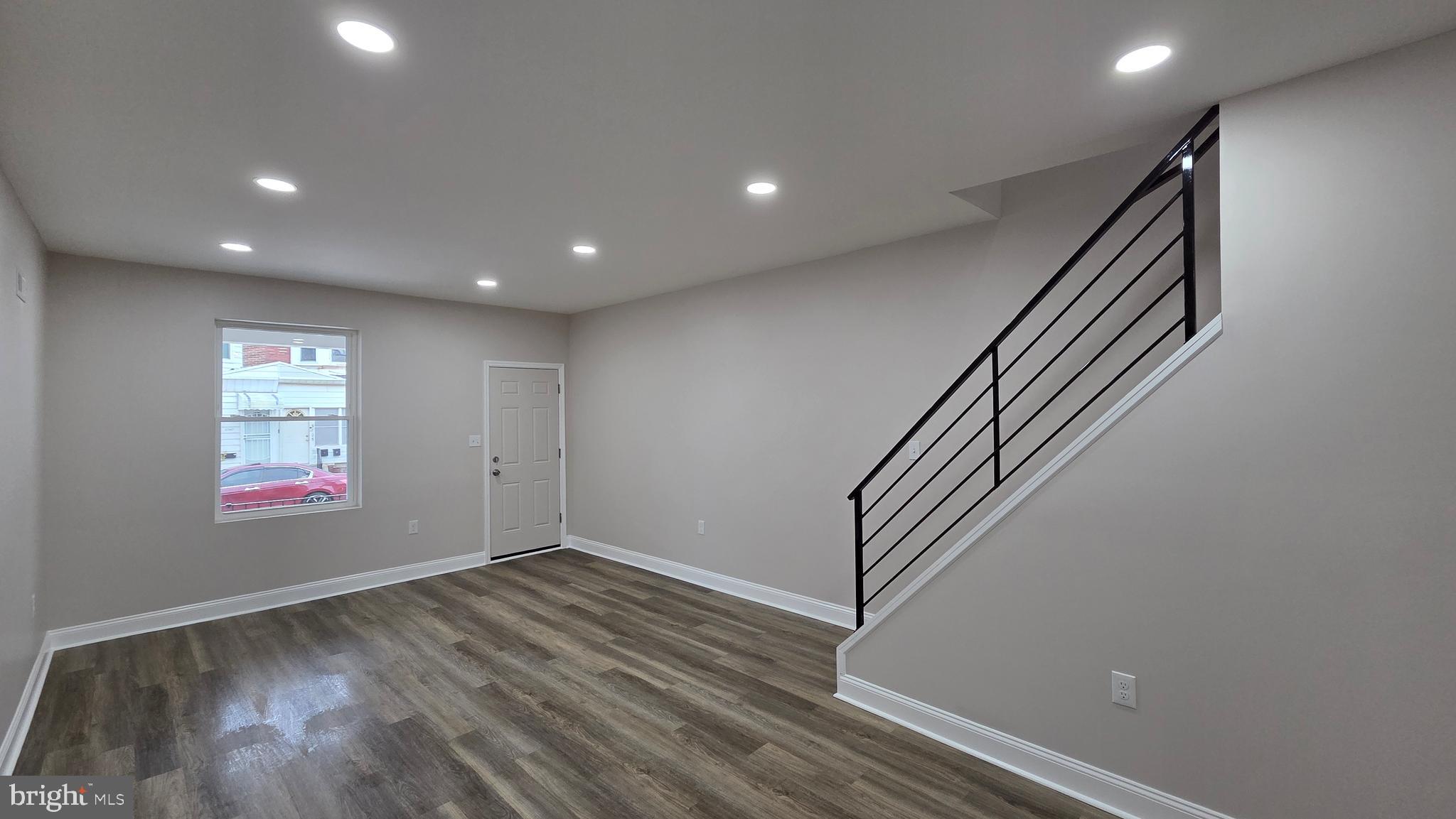 5706 Vandike Street Philadelphia, PA 19135 - Photo 7 of 32 an entryway in hall with wooden floor and stairs