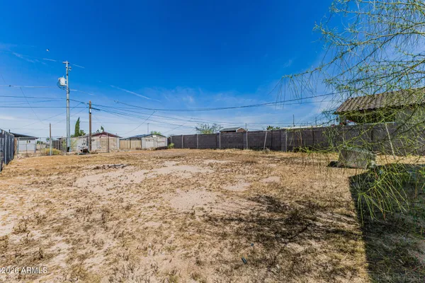 a view of a backyard of the house