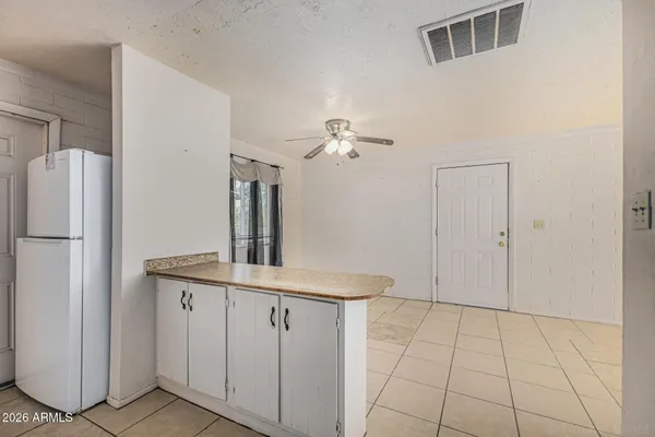 a kitchen with a sink cabinets and stainless steel appliances