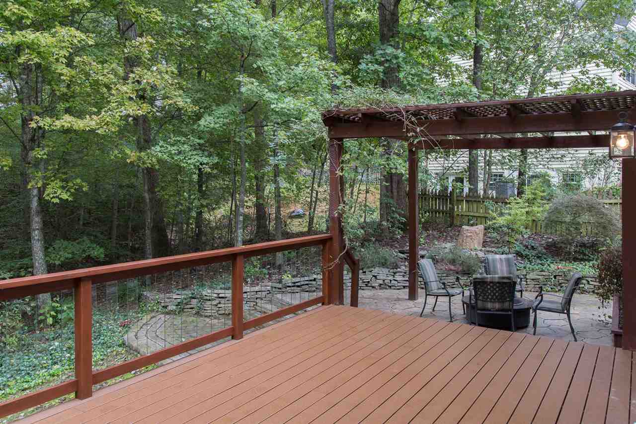 72 Willow Way Road Barboursville, VA 22923 - Photo 16 of 50 2 sets of French doors open up the living space to the forested back yard. It is spectacular during the fall. The balusters on the deck railing are manufactured by Frontier Glass Balusters by DecKorators of safety tempered and shatter resistant glass.