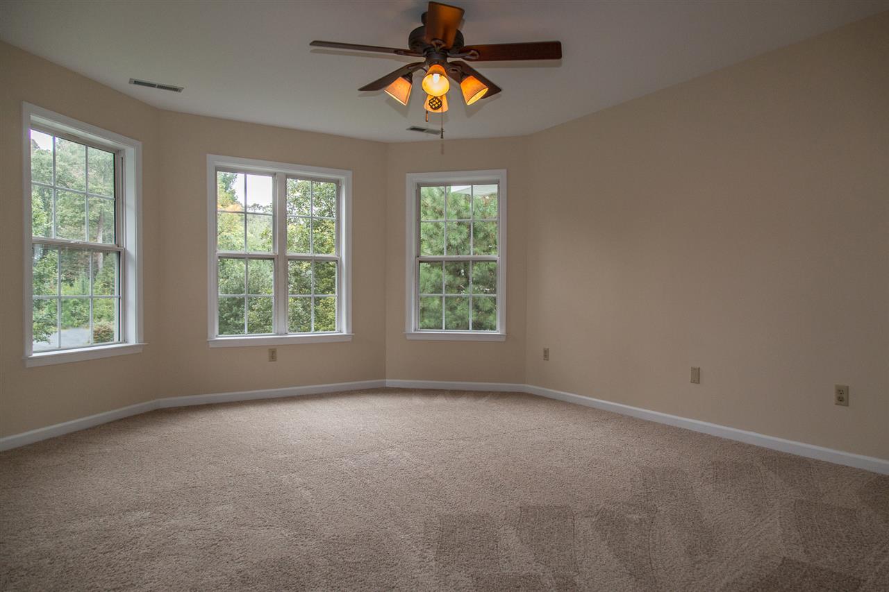 72 Willow Way Road Barboursville, VA 22923 - Photo 30 of 50 The master bedroom has a floor to ceiling bay with 4 windows overlooking the lush front yard, The soft color theme continues in the wall color and new carpeting.