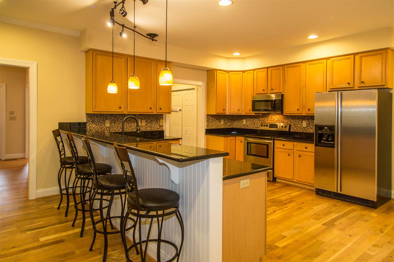 72 Willow Way Road Barboursville, VA 22923 - Photo 4 of 50 Cafe Imperial granite countertops, cherry cabinets, tile backsplash and stainless steel appliances. The 3/4" oak floors were refinished in 2015. Tear drop lights over breakfast bar emphasize the seating area! Recess can lights keep kitchen bright.