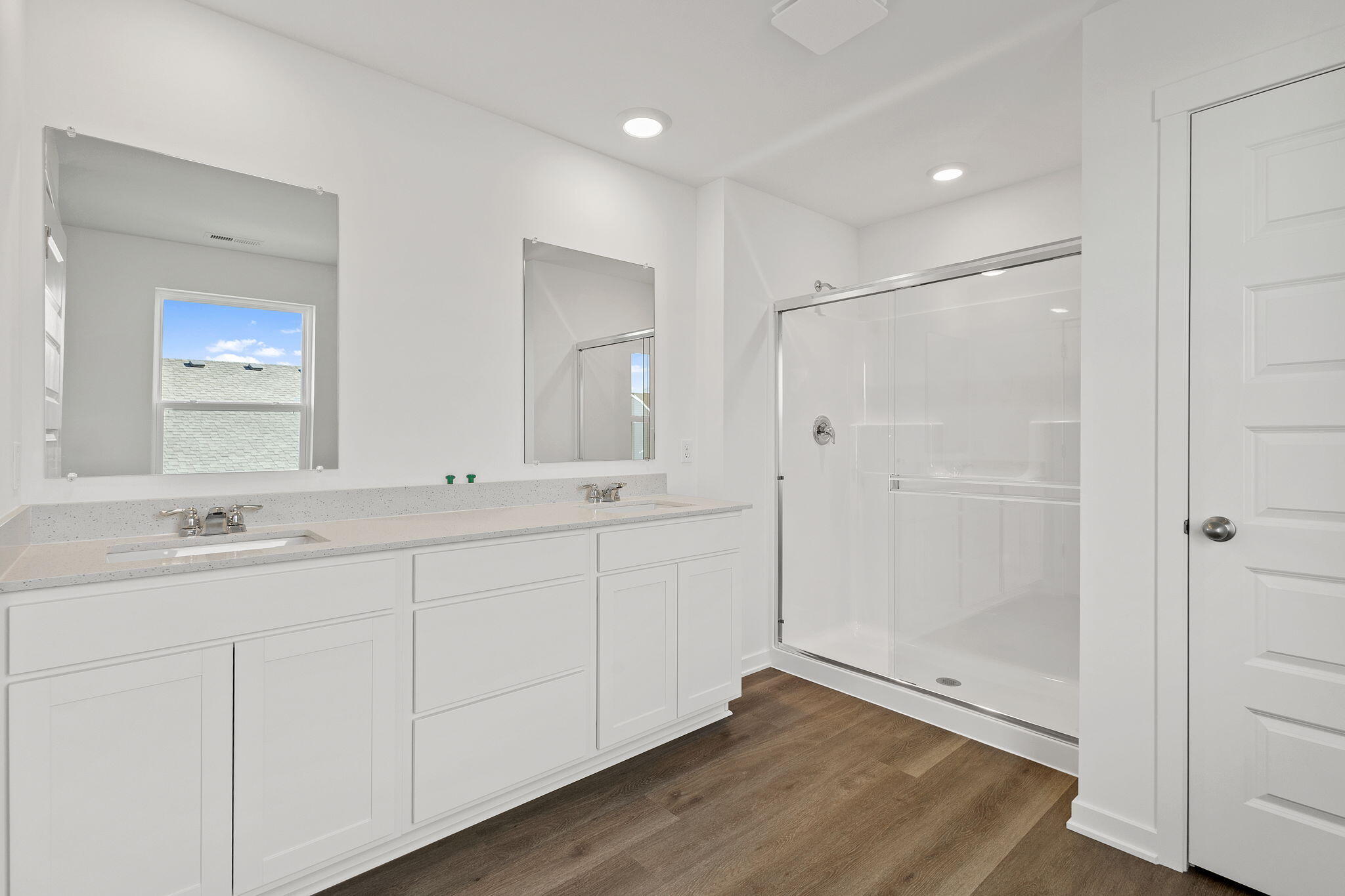 10681 Blaine Street Crown Point, IN 46307 - Photo 15 of 25 a bathroom with a double vanity sink and mirror